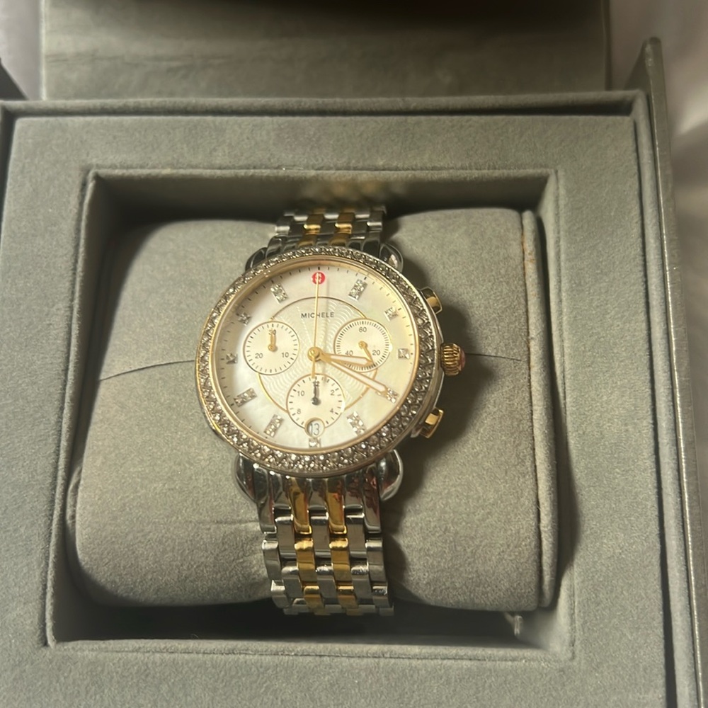Timeless Michele watch silver and gold straps diamond face.